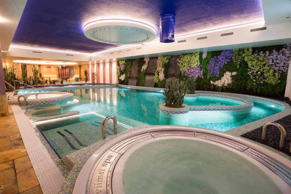 a pool in a hotel with two large pools at Viimsi Spa & Waterpark in Tallinn