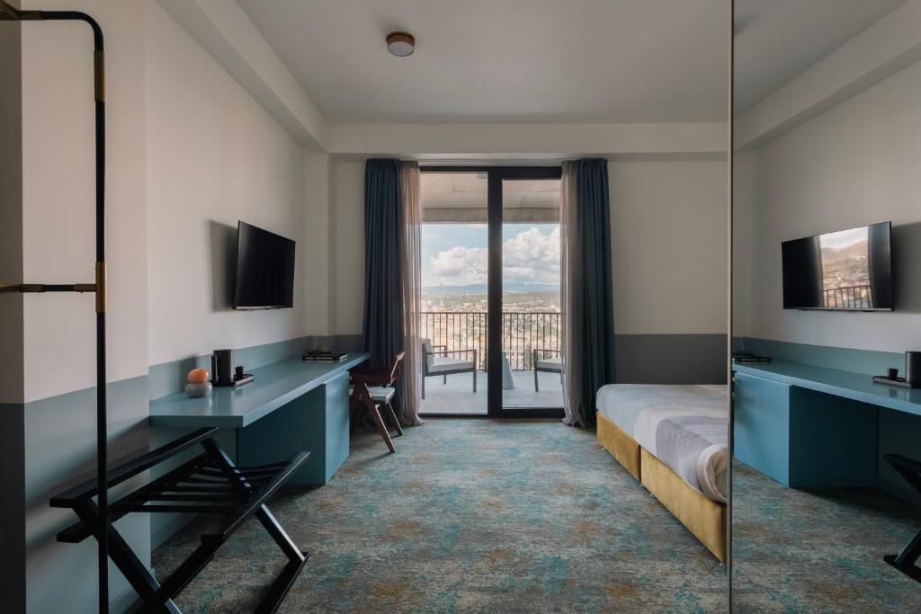 TV a/nebo společenská místnost v ubytování Castor & Pollux Hotel