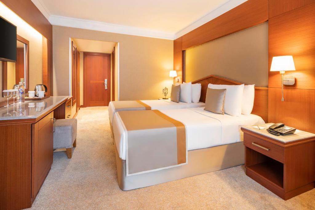 A bed or beds in a room at Vicenza Hotel Istanbul Old City