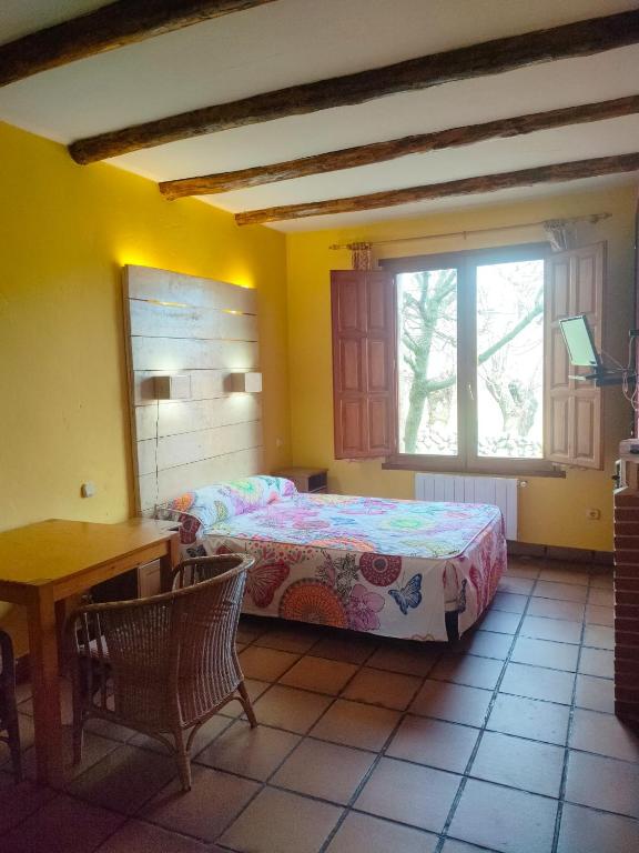 Cama o camas de una habitación en Alojamientos La Dehesa