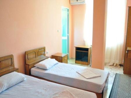 Postel nebo postele na pokoji v ubytování SIRENA HOTEL
