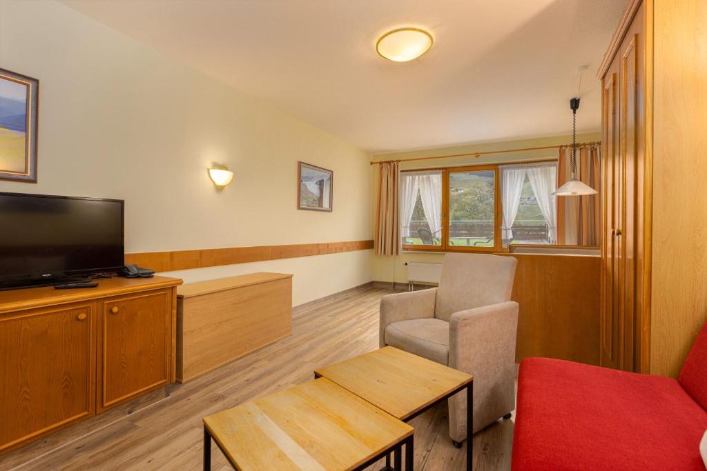 TV a/nebo společenská místnost v ubytování IFA Breitach Apartments Kleinwalsertal