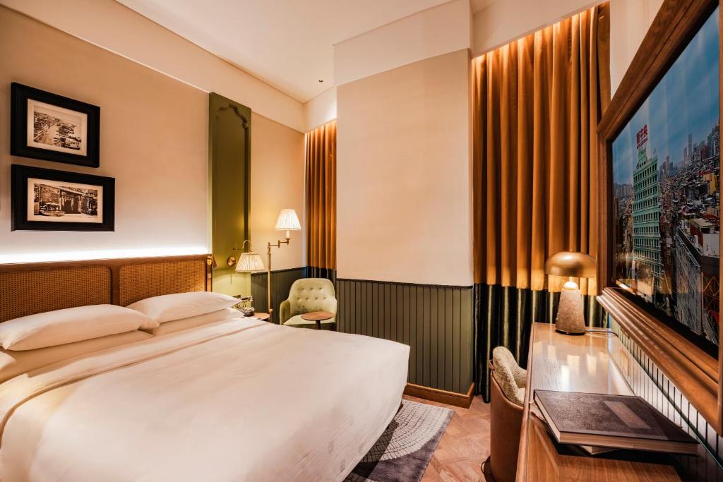 Postel nebo postele na pokoji v ubytování Hotel Central 新中央酒店
