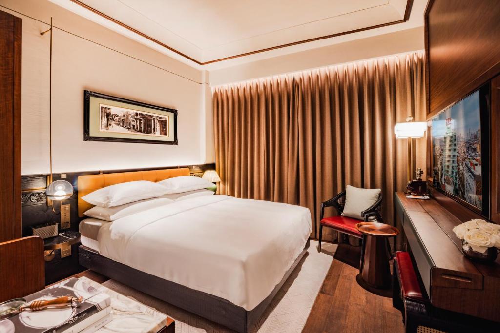 Postel nebo postele na pokoji v ubytování Hotel Central 新中央酒店