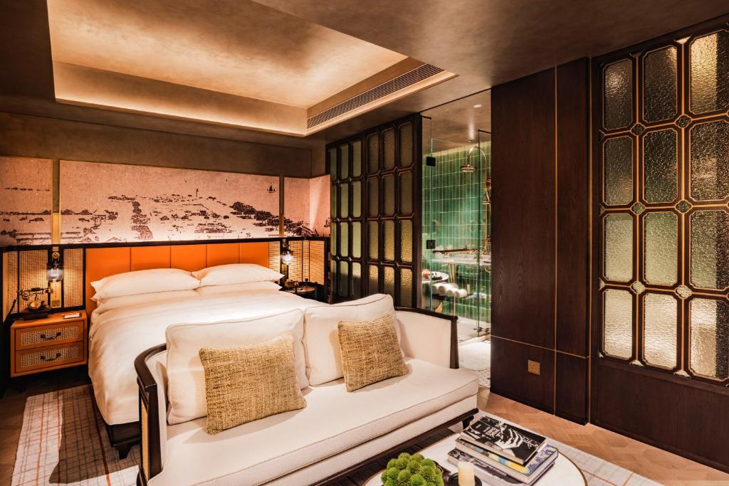 Postel nebo postele na pokoji v ubytování Hotel Central 新中央酒店