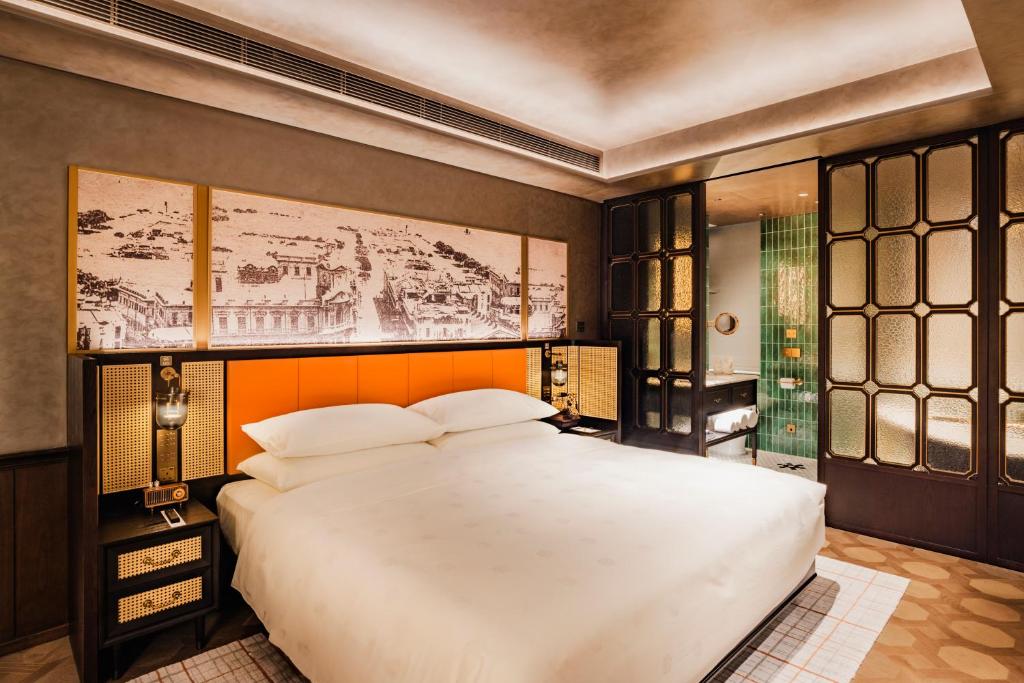 Postel nebo postele na pokoji v ubytování Hotel Central 新中央酒店
