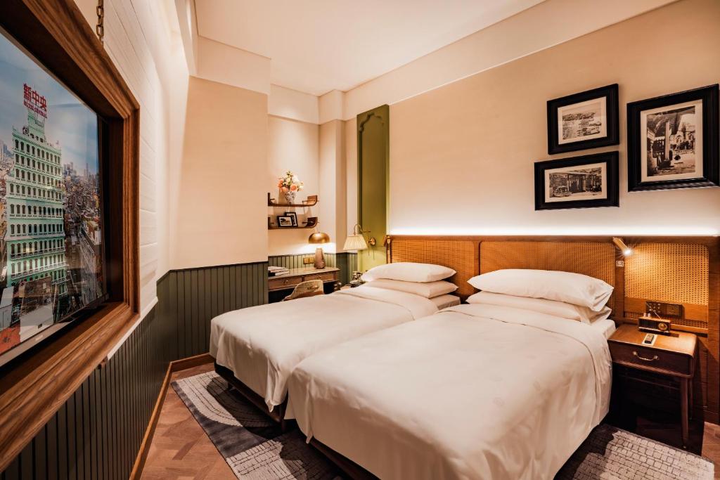 Postel nebo postele na pokoji v ubytování Hotel Central 新中央酒店