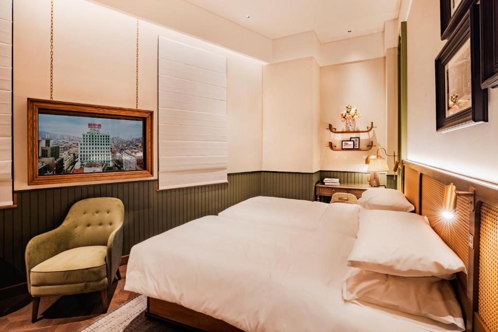 Postel nebo postele na pokoji v ubytování Hotel Central 新中央酒店