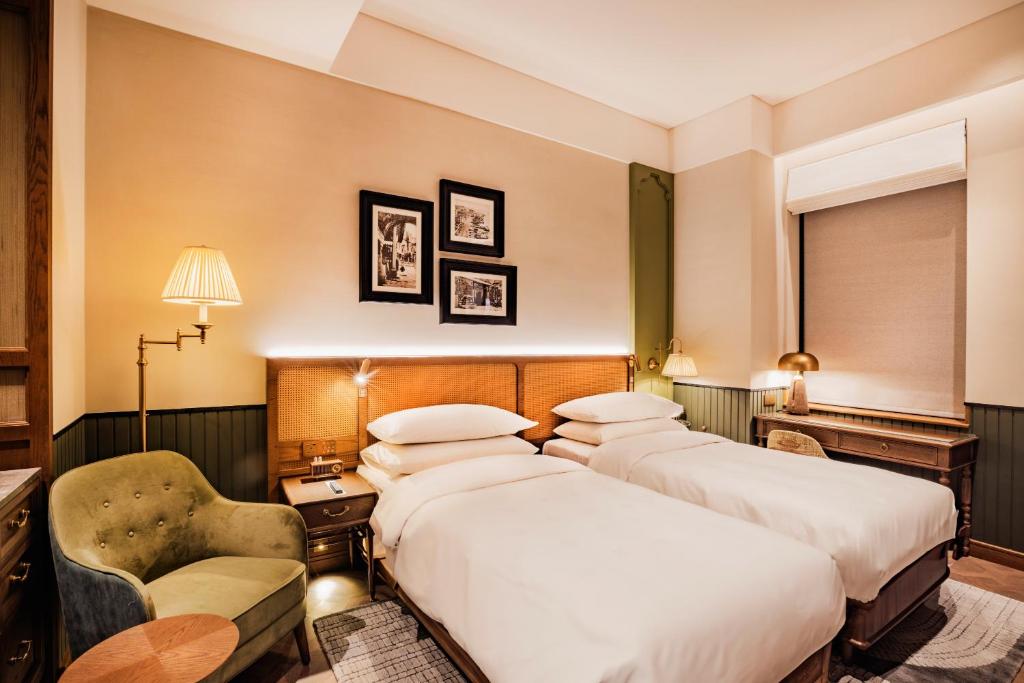 Postel nebo postele na pokoji v ubytování Hotel Central 新中央酒店
