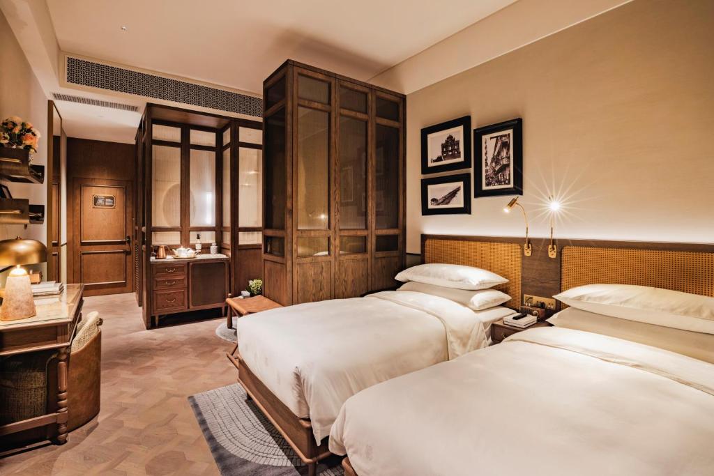 Postel nebo postele na pokoji v ubytování Hotel Central 新中央酒店