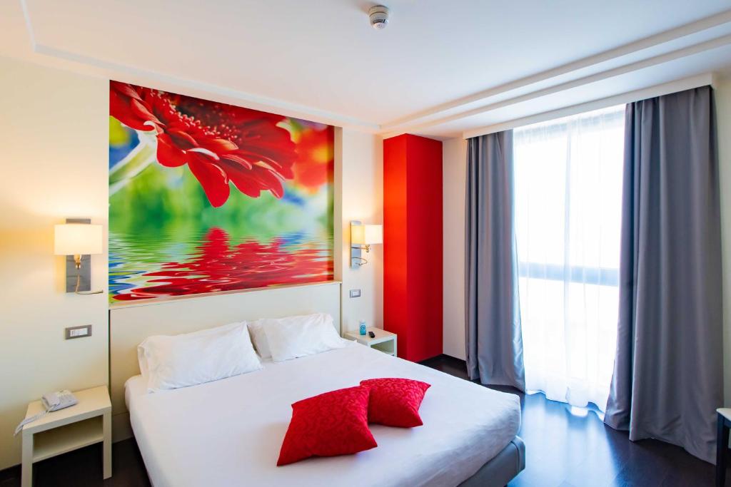 Postel nebo postele na pokoji v ubytování AN Hotel Milano Melegnano