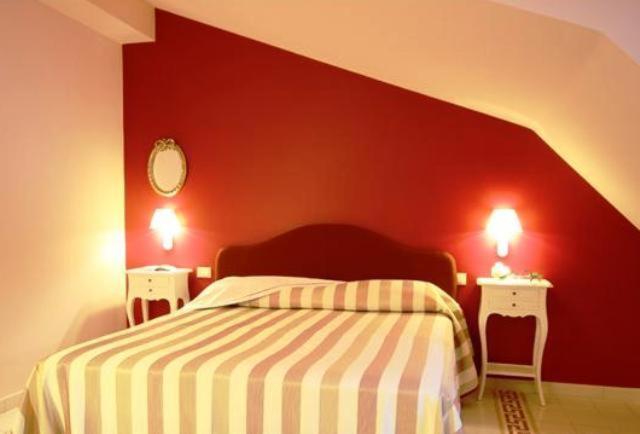 Postel nebo postele na pokoji v ubytování Palace Hotel Una Nuova Strada