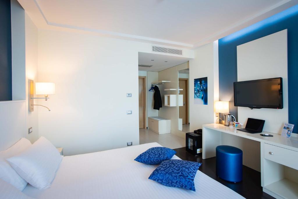 Postel nebo postele na pokoji v ubytování AN Hotel Milano Melegnano
