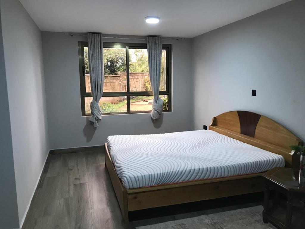 Postel nebo postele na pokoji v ubytování Runda Serene Accomodation