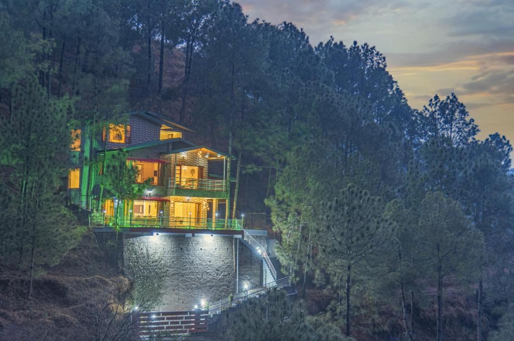 a house on a bridge over a river at THE BLISSFUL BREEZE VILLA KASAULI BY EXOTIC STAYS in Kasauli