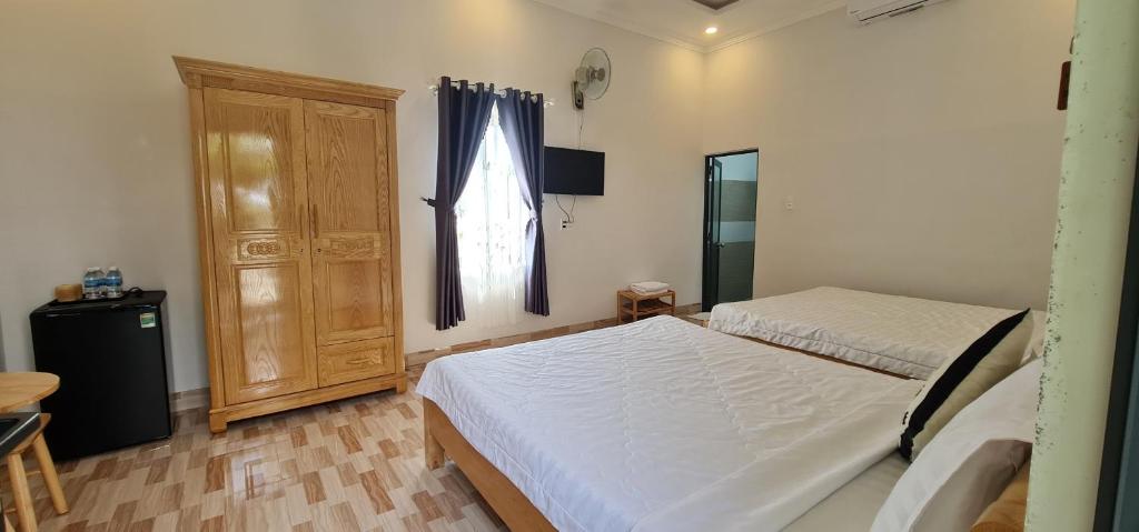 Postel nebo postele na pokoji v ubytování Sunrise Dốc Lết