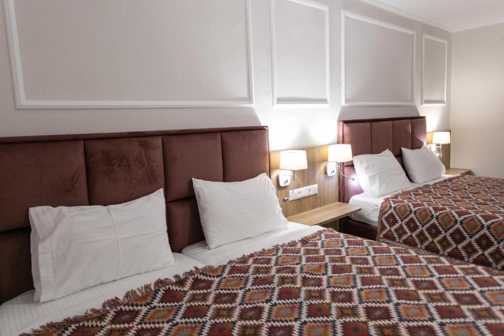 Postel nebo postele na pokoji v ubytování Paradise Hotel