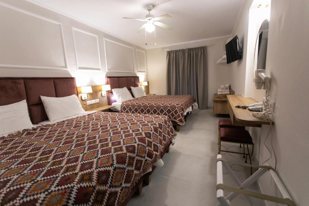 Postel nebo postele na pokoji v ubytování Paradise Hotel
