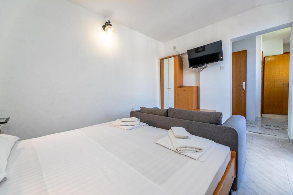 Posteľ alebo postele v izbe v ubytovaní Apartments Janko Zarok