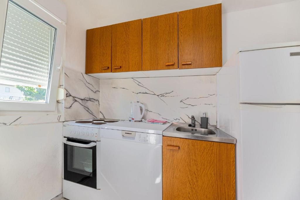 Kuchyňa alebo kuchynka v ubytovaní Apartments Janko Zarok