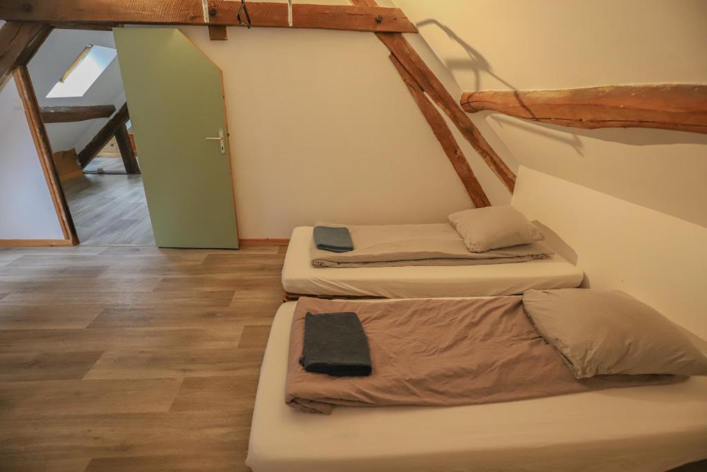 a room with three bunk beds in it at Crazy Villa Champs Corons 61 - Interior heated pool - 2h from Paris - 30p in Les Menus