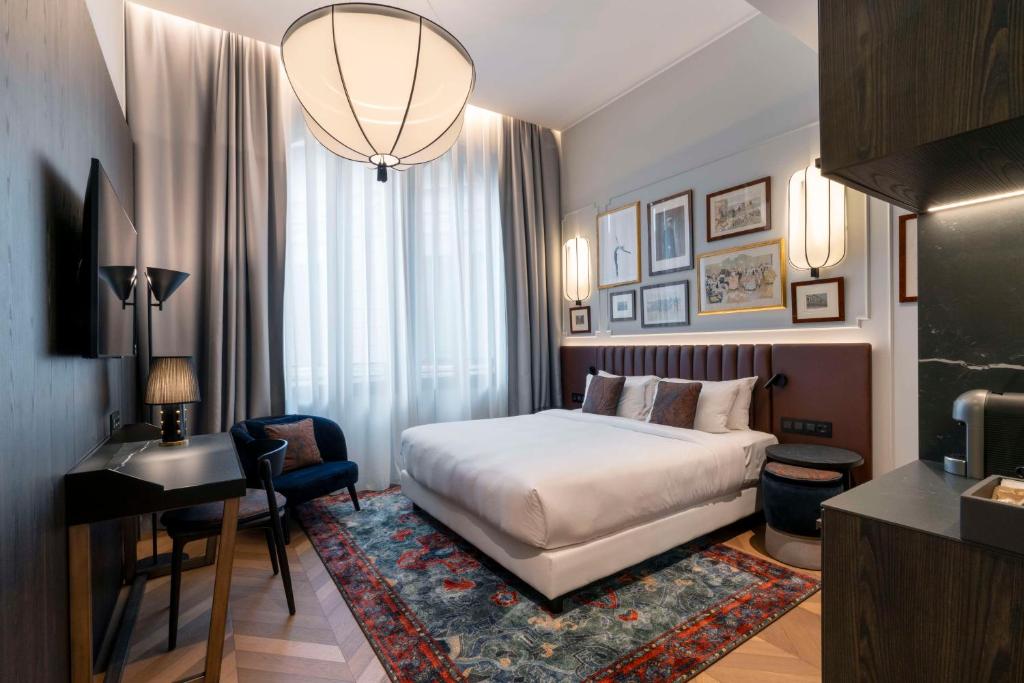 Postel nebo postele na pokoji v ubytování Radisson Collection Hotel, Palazzo Touring Club Milan
