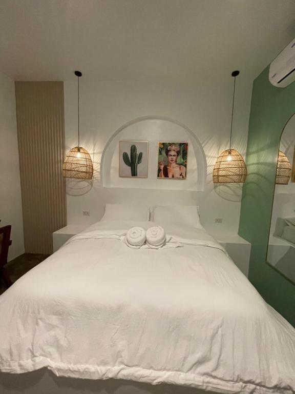 Postel nebo postele na pokoji v ubytování MAAYONG HOSTEL