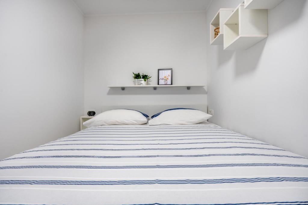 Postel nebo postele na pokoji v ubytování Studio Apartman Tonka