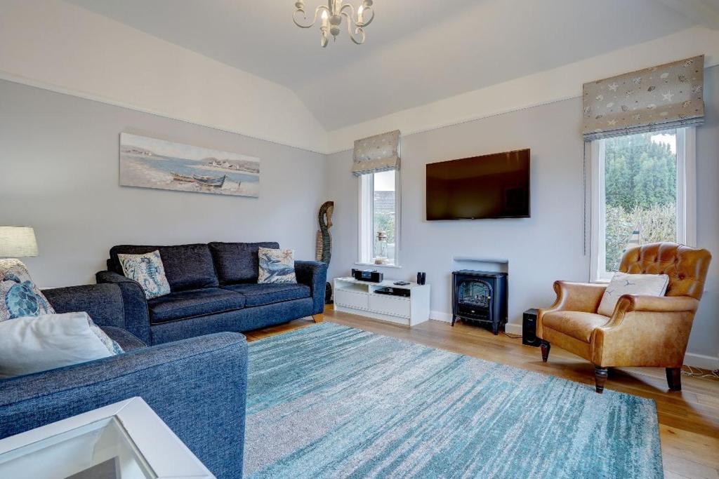 Et tv og/eller underholdning på Sunny View by Winterton Cottages