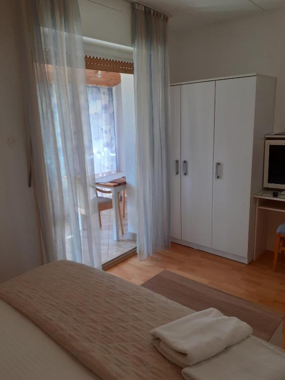 Postel nebo postele na pokoji v ubytování Guesthouse Apartment Božica