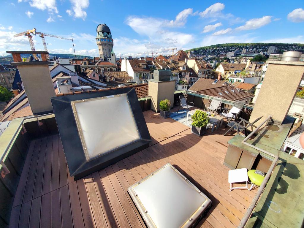 a view of a city from the roof of a building at ROOFTOP with stunning views in Zurich