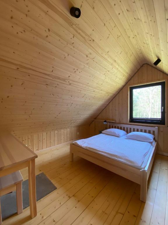Postel nebo postele na pokoji v ubytování Domki nad Kukówkiem