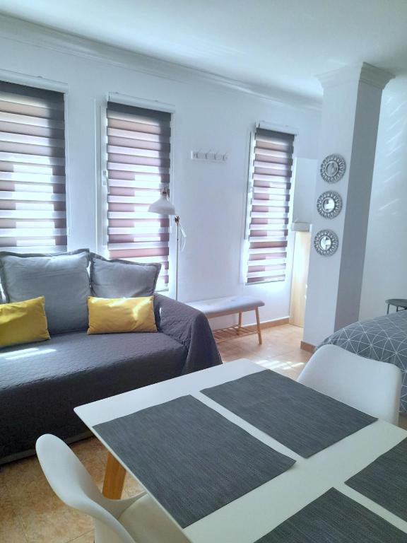 a living room with a couch and a table at Apartamento Ocean in Arinaga