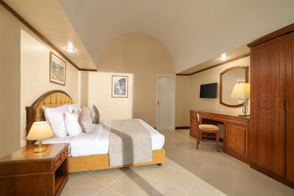 Postel nebo postele na pokoji v ubytování JAZ Pyramids Resort