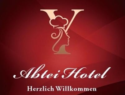 a red background with a logo for a herbal hotel at Abtei Hotel in Brauweiler