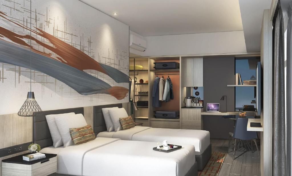 Postel nebo postele na pokoji v ubytování Citadines Bacolod City