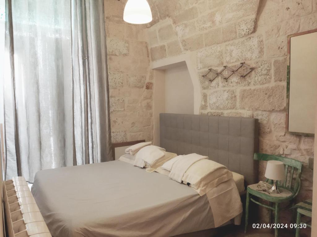 Postel nebo postele na pokoji v ubytování Dimora delle Badesse