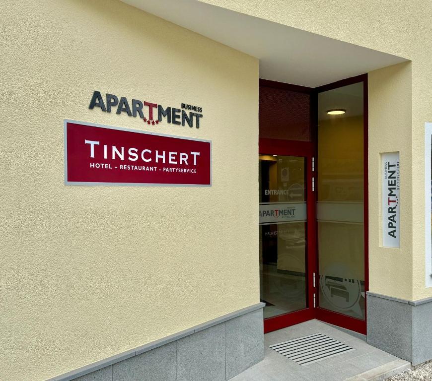a sign on the side of a building at Business Appartment by Tinschert in Schwertberg
