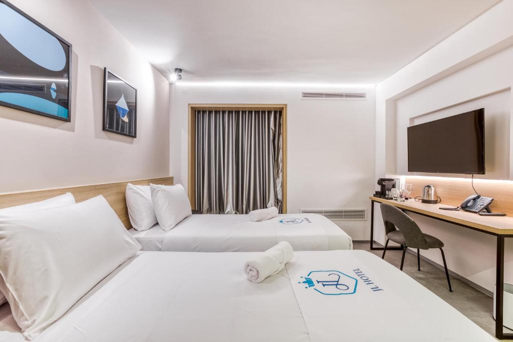 Postel nebo postele na pokoji v ubytování JL Hotel