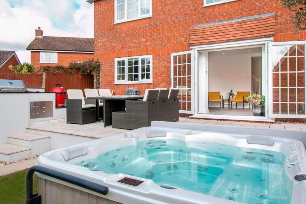 a hot tub in the backyard of a house at BOURNECOAST: *HOT TUB*BBQ HUT*GYM*GARDEN* HB6340 in Bournemouth