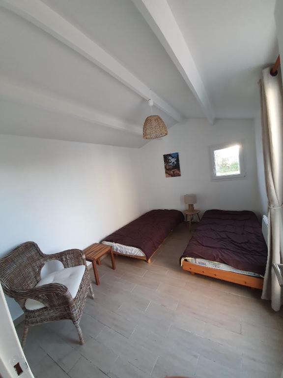 Posteľ alebo postele v izbe v ubytovaní Maison avec jardin à 200m de la plage La Cantine