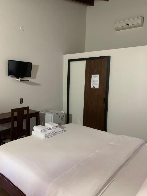 Postel nebo postele na pokoji v ubytování Hotel Il Castello