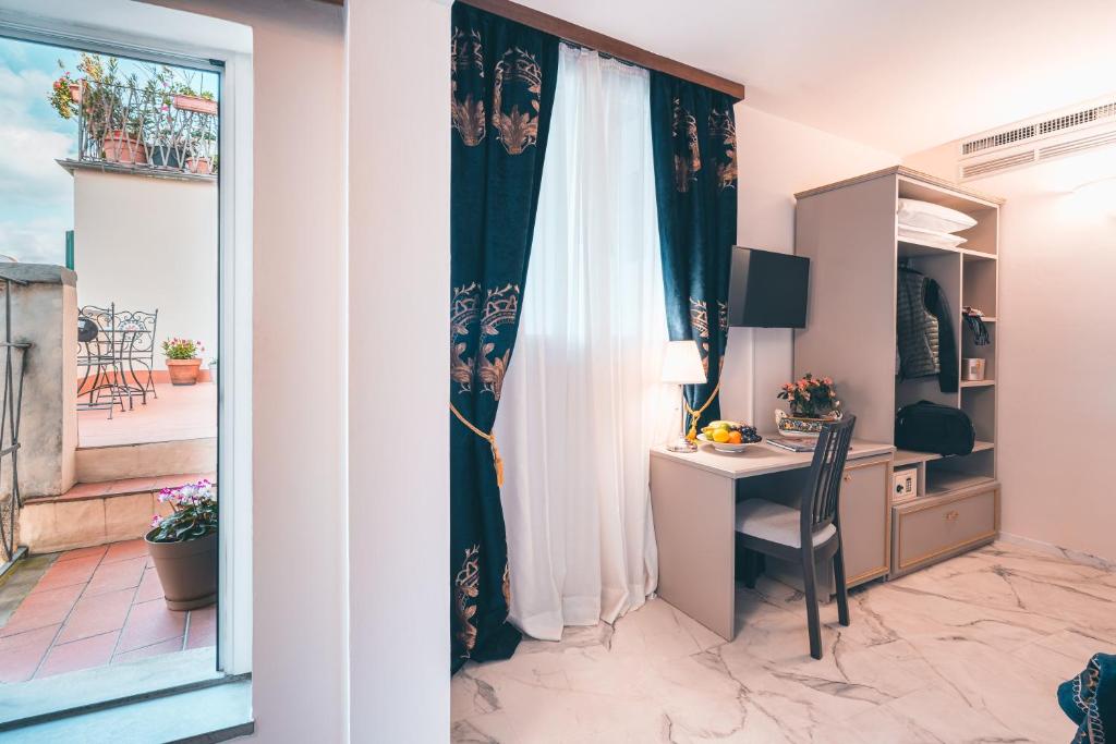 TV a/nebo společenská místnost v ubytování Hotel Palazzo Benci