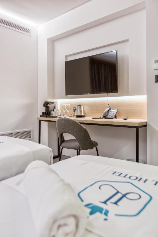 Postel nebo postele na pokoji v ubytování JL Hotel