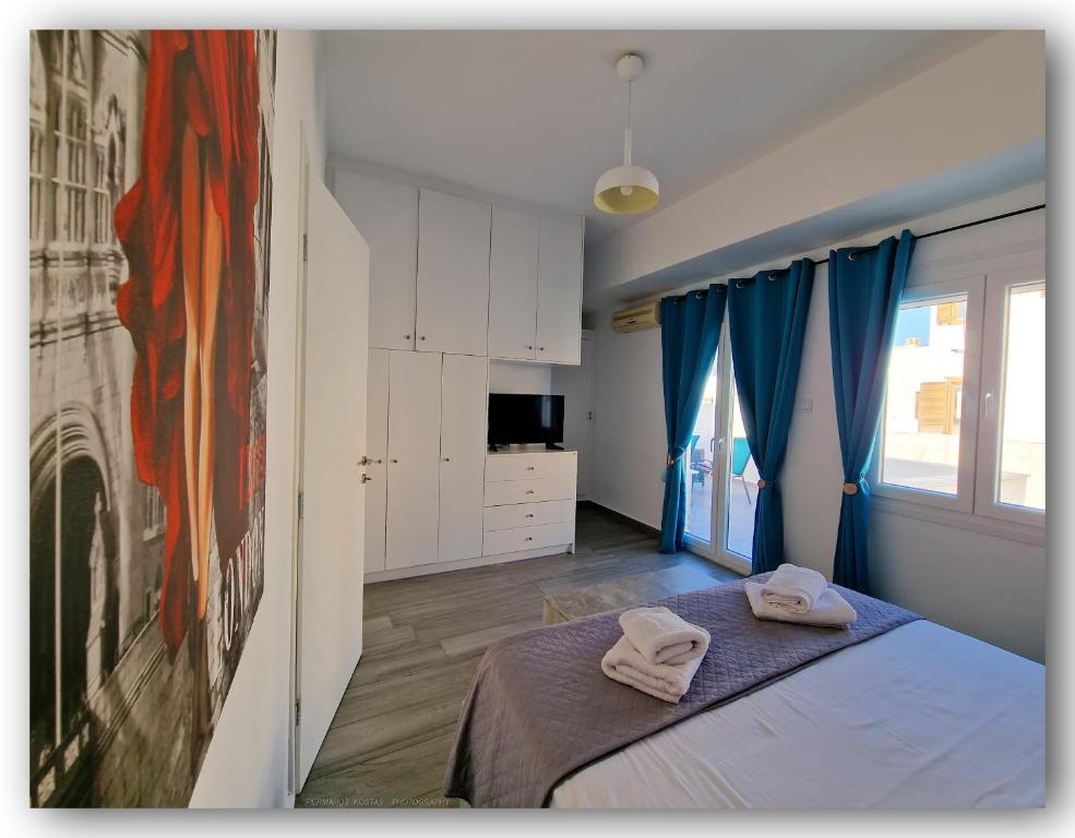Postel nebo postele na pokoji v ubytování Welcome Home Syros Port Apartment