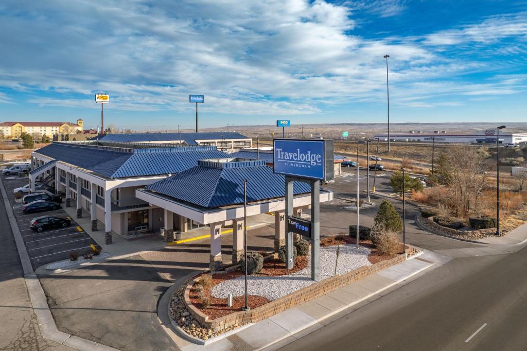an overhead view of a building with a sign in front at Travelodge by Wyndham Pueblo in Pueblo