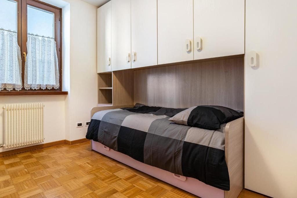 Postel nebo postele na pokoji v ubytování Appartamento Cles