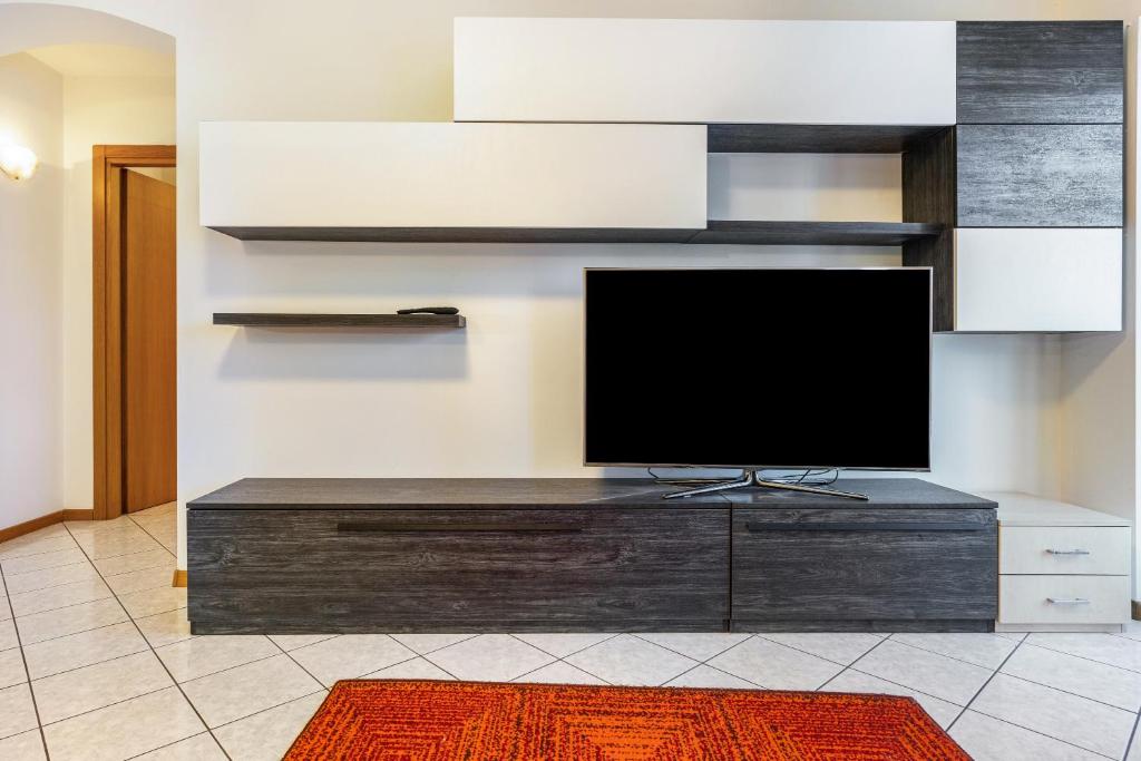 TV a/nebo společenská místnost v ubytování Appartamento Cles