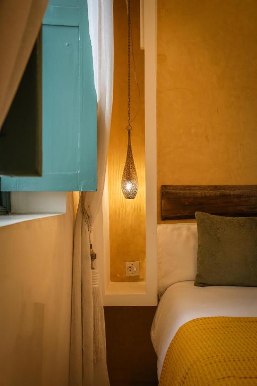 Postel nebo postele na pokoji v ubytování Riad 11 Zitoune
