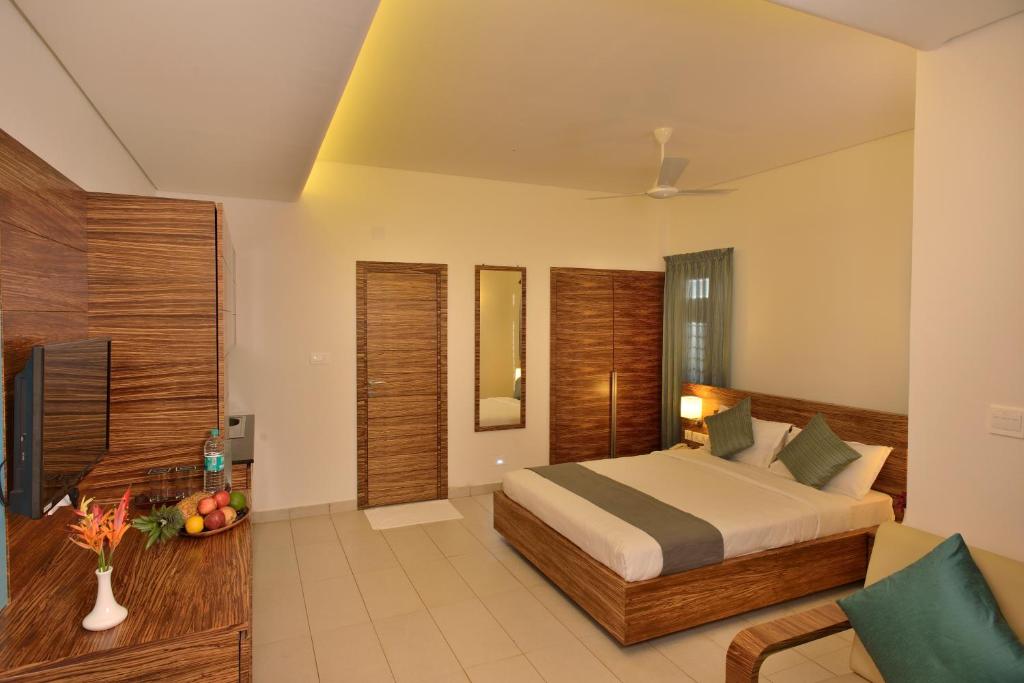 Posezení v ubytování The Woods Resorts Wayanad